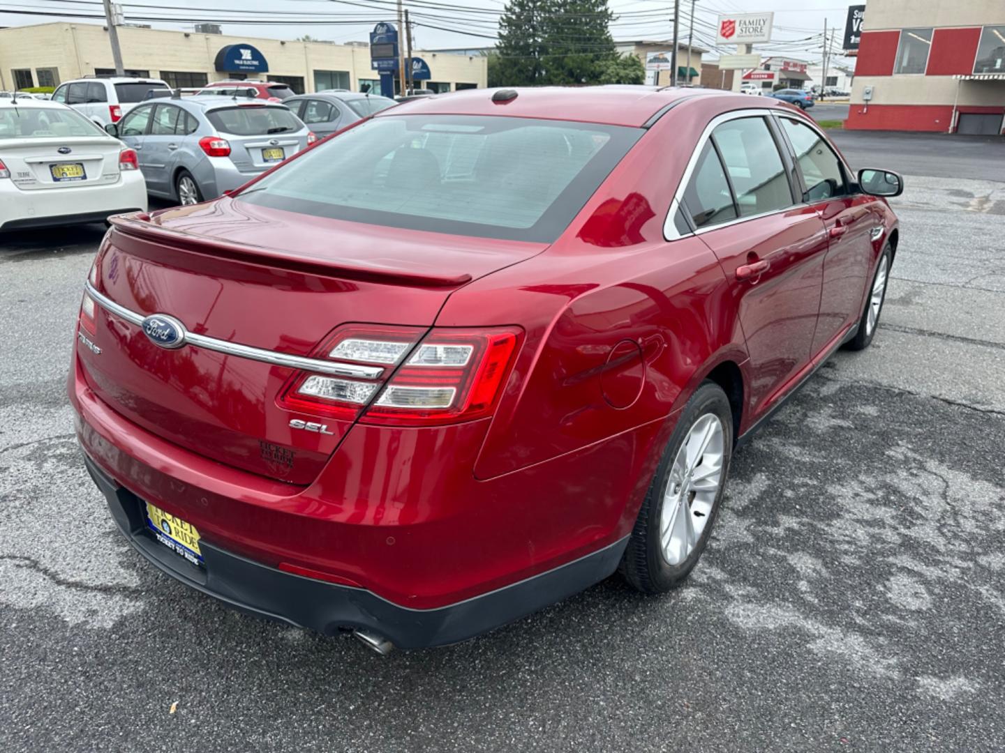 2013 RED Ford Taurus SEL FWD (1FAHP2E8XDG) with an 3.5L V6 DOHC 24V engine, 6-Speed Automatic transmission, located at 1254 Manheim Pike, Lancaster, PA, 17601, (717) 393-9133, 40.062870, -76.323273 - Photo#4